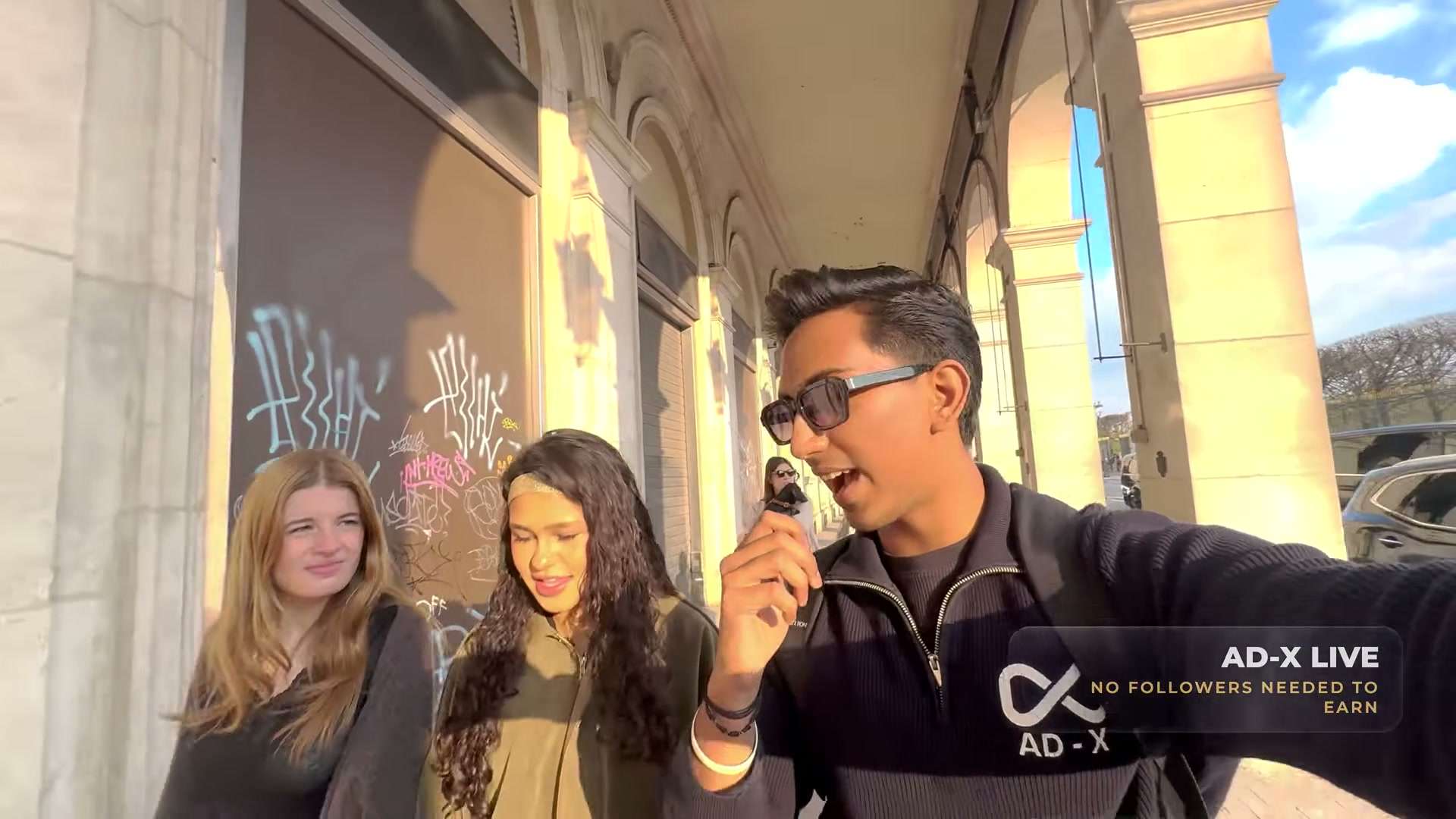 AD-X Live's founder walking a Paris street, explaining the platform to camera.
